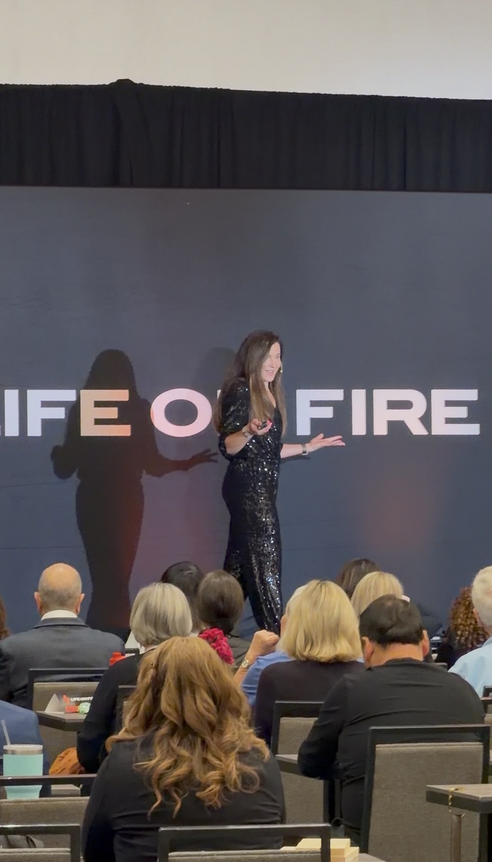 Willa Kammerer speaking to a full room at Life on Fire Live in Dallas